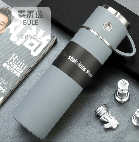 16.91oz double wall stainless steel thermal mug with a black lid and handle, designed for hot and cold beverages.