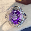 Amethyst fashion ring for women featuring a large purple gemstone set in silver band, stylish jewelry accessory.