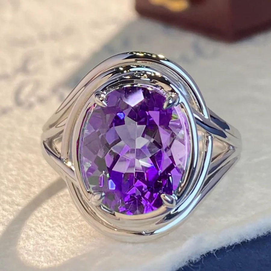 Amethyst fashion ring for women featuring a large purple gemstone set in silver band, stylish jewelry accessory.