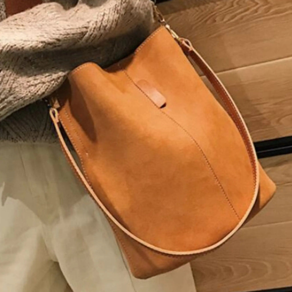 Brown Blake Shoulder Bag by My Store showing a stylish leather handbag with a shoulder strap and gold-tone hardware.