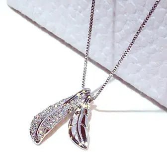 Korean style leaf pendant choker necklace with delicate design, featuring a fashionable leaf charm on a sleek black cord.