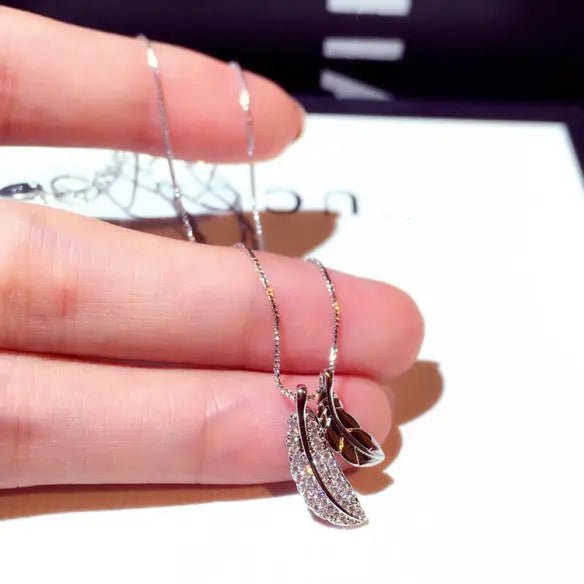 Korean style leaf pendant choker necklace with a trendy, fashionable design, featuring a delicate leaf charm on a sleek black cord.