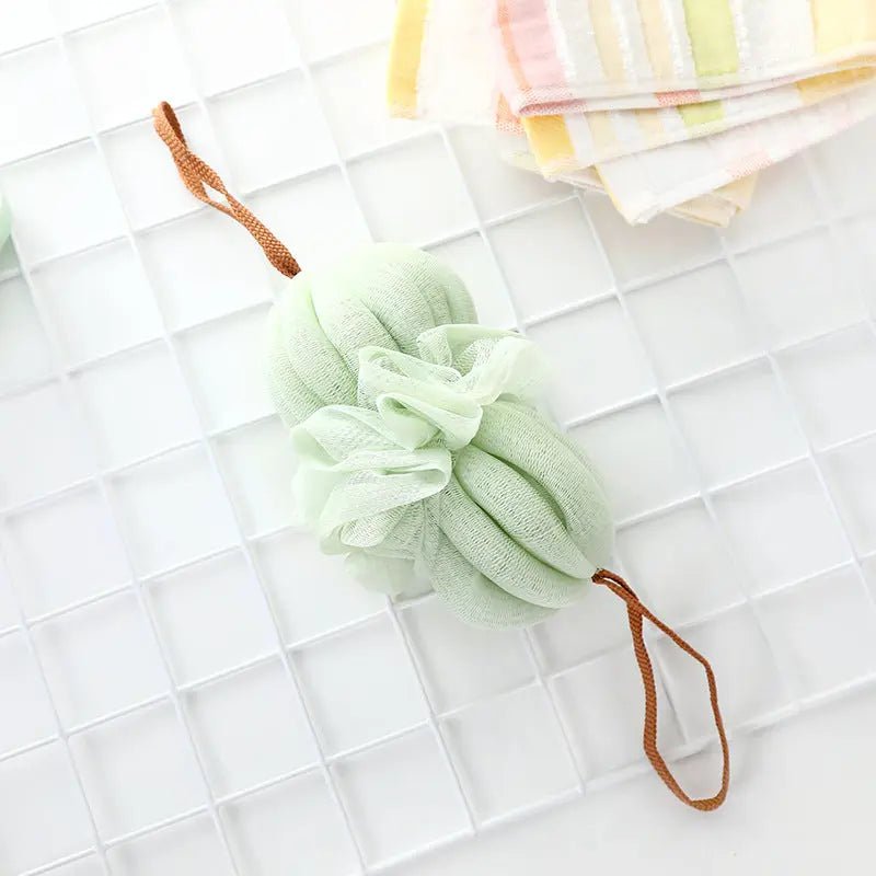 Large Japanese bath towel with soft fabric and exfoliating bath ball for gentle cleansing and relaxation in the shower or bath.