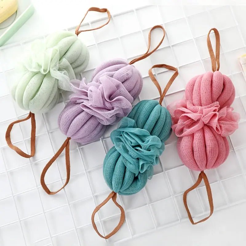 Large Japanese bath towel with textured fabric and exfoliating bath ball for relaxing spa-style bathing.
