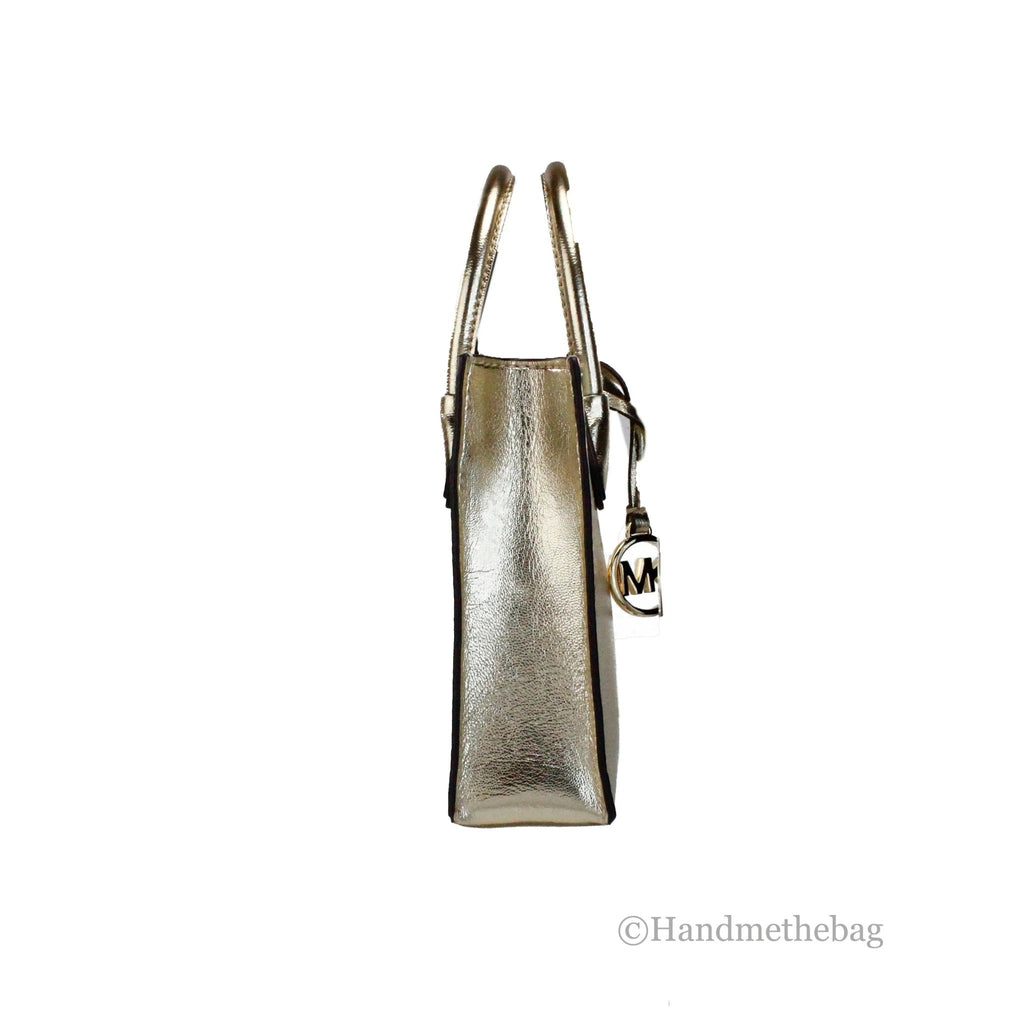 Michael Kors Mercer XS Pale Gold North South Crossbody Bag showing front view with adjustable strap and gold hardware.