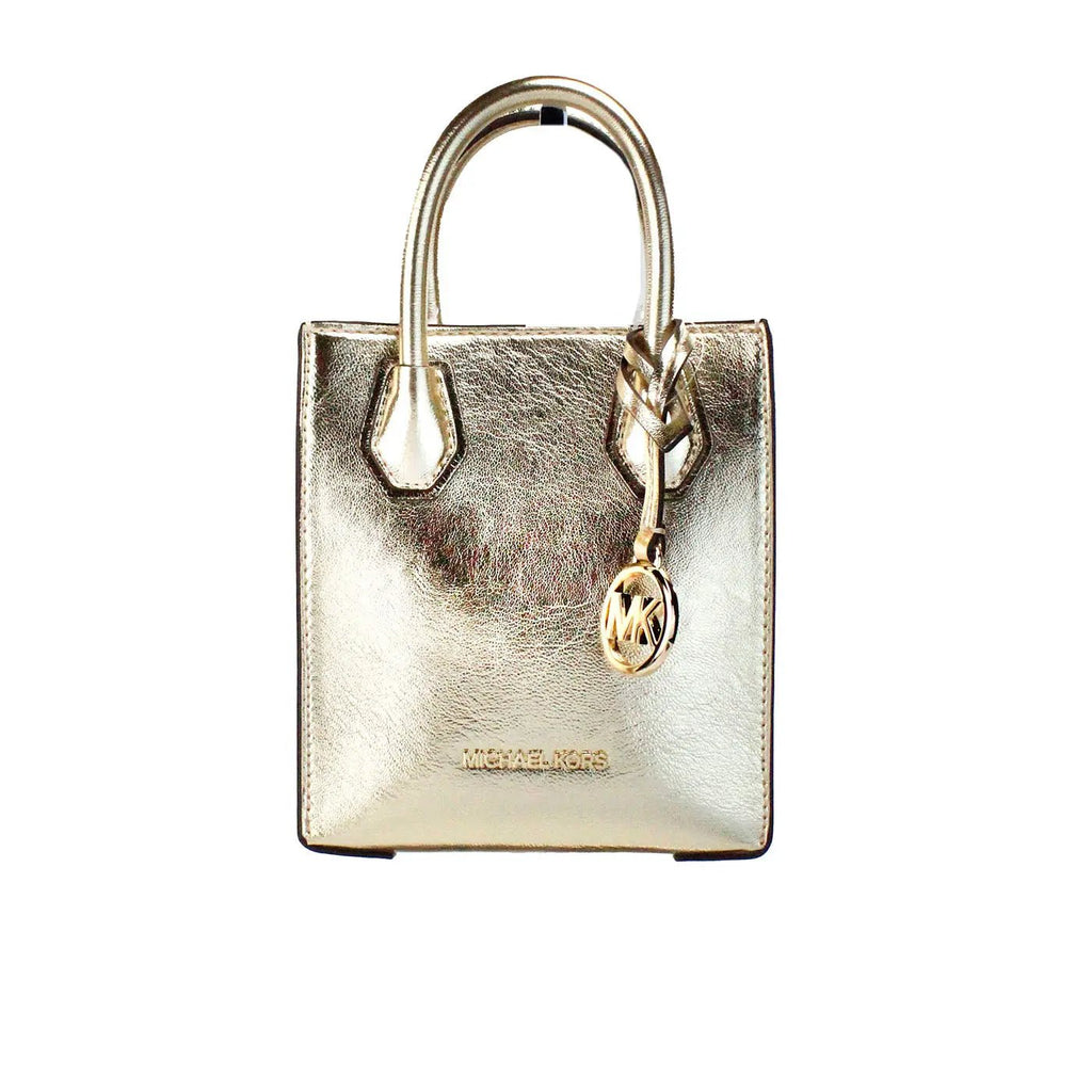 Michael Kors Mercer XS pale gold crossbody bag with sleek design and gold-tone hardware, perfect for stylish everyday use.