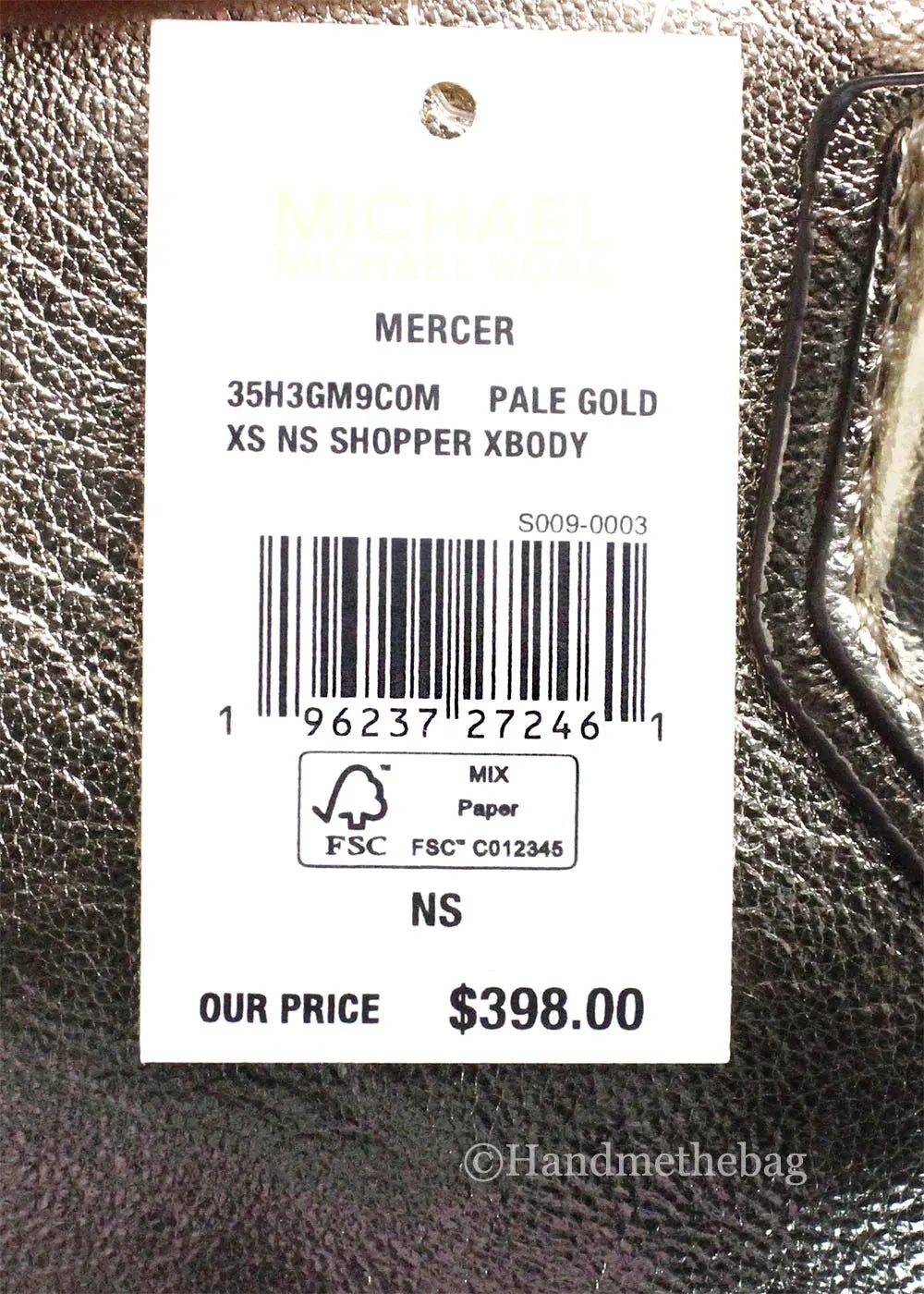 Michael Kors Mercer XS pale gold crossbody bag with sleek design and gold-tone hardware, showcasing the North South style.