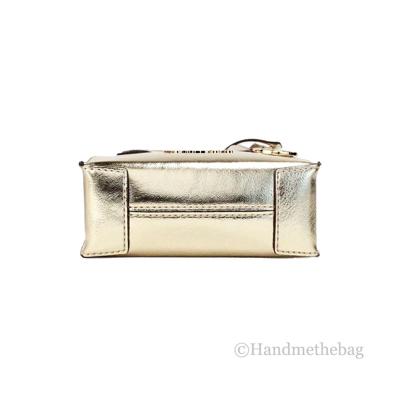 Michael Kors Mercer XS Pale Gold crossbody bag with adjustable strap and gold-tone hardware, showcasing a sleek compact design.