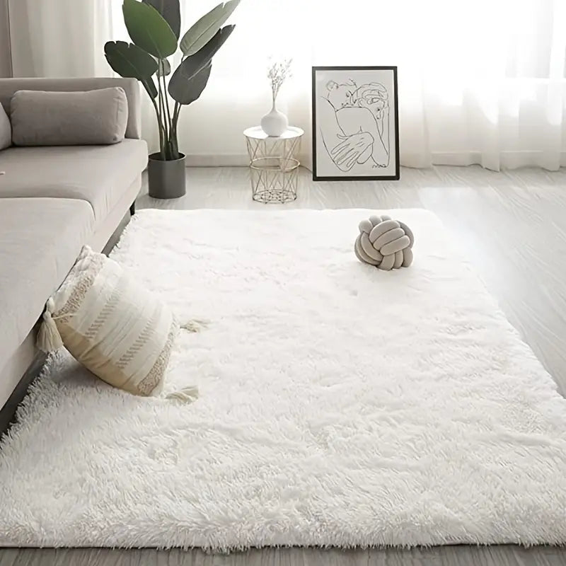 Soft square plush rug and decorative throw blanket in beige, measuring 47x63 inches, featuring cozy, textured fabric.
