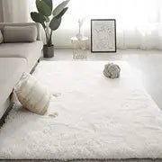 Soft square plush rug and decorative throw blanket in beige, measuring 47x63 inches, perfect for cozy home decor.