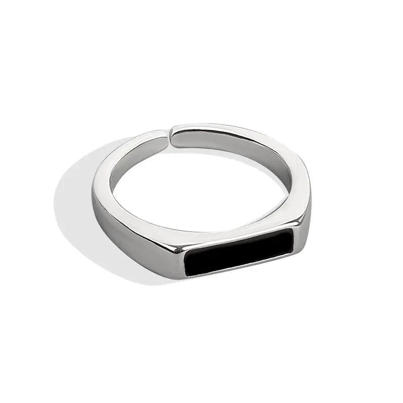 Sterling silver black ring featuring a cool wind-inspired design, showcasing intricate details and a sleek, modern style.