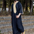 Black men's long shirt Muslim robe with stylish design, featuring a comfortable fit and elegant look.