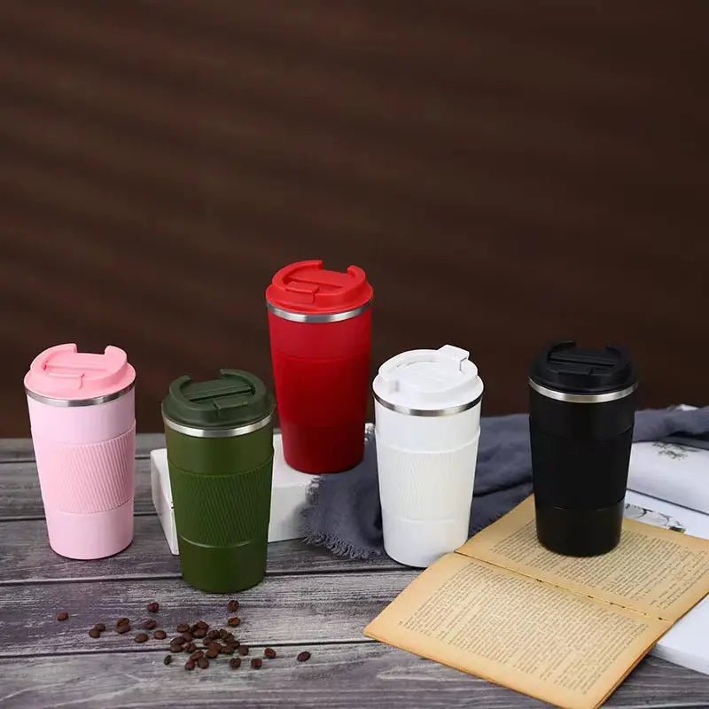 Stainless steel vacuum insulated travel mug with lid, designed to keep beverages hot or cold during travel.