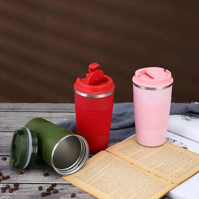 Stainless steel vacuum insulated travel mug with lid for hot and cold beverages, designed for on-the-go use.