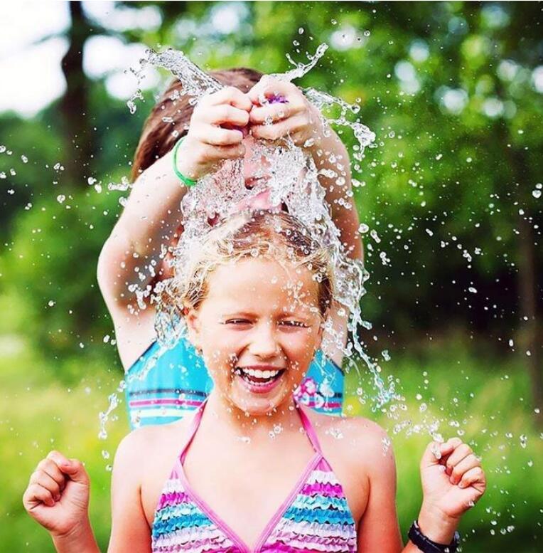 Colorful water balloons with quick fill feature from My Store, ready for outdoor summer fun and water fights.