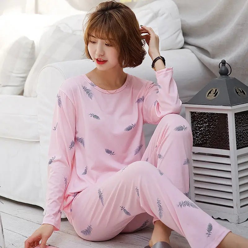 Women's long-sleeved pajama set with a cute design, soft fabric, and relaxed fit for comfortable sleepwear.